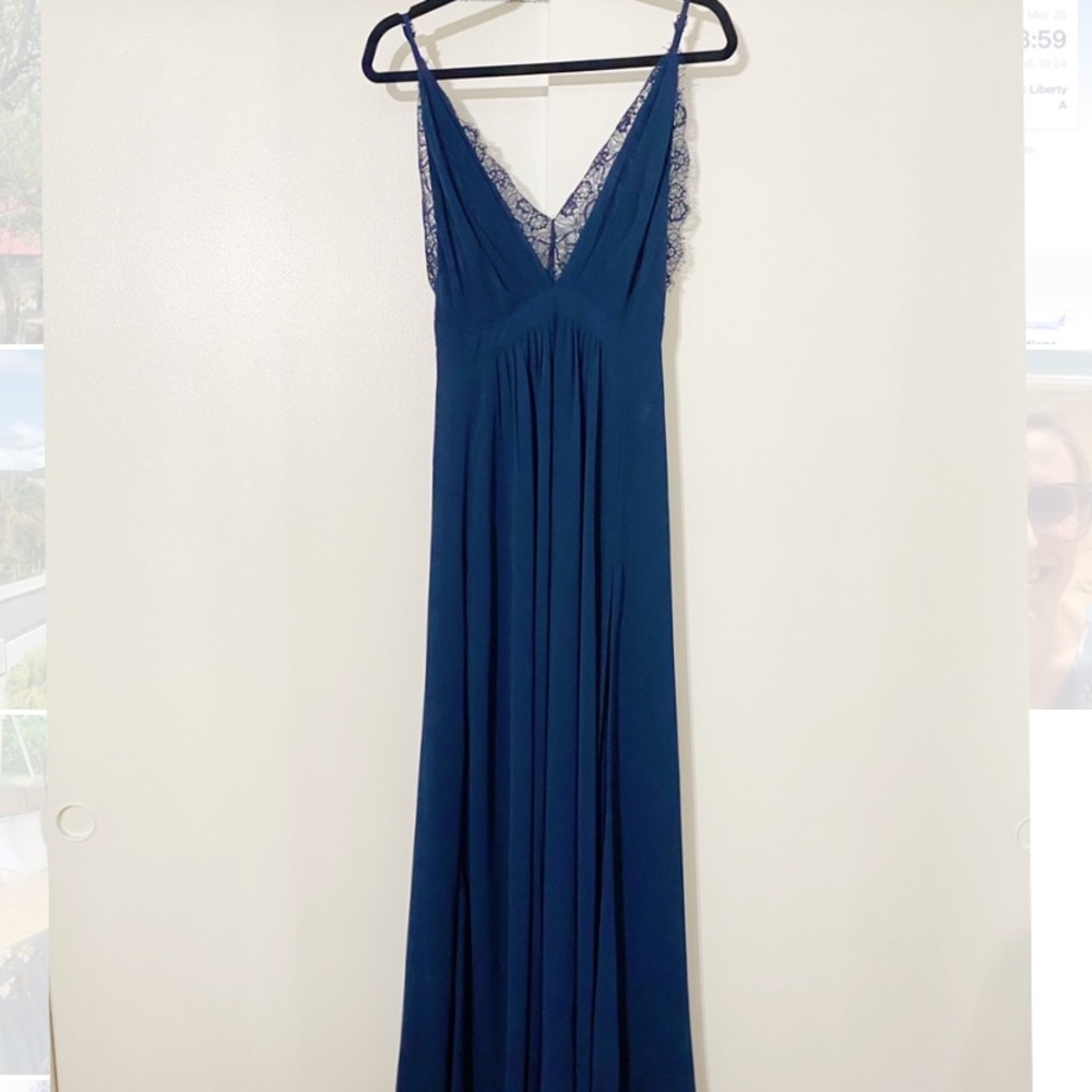 This Navy Blue floor length gown is perfect for any formal event.